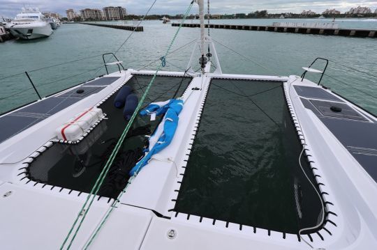 The front part of the boat features a classic trampoline