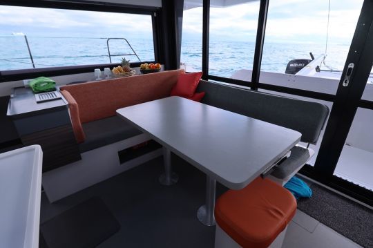 A L shaped galley and a L shaped couch are located on straboard