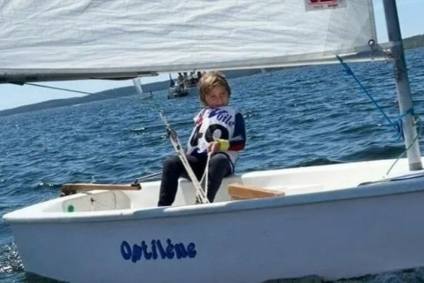 Benjamin Mano at the helm of his optimist