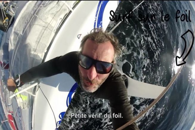 Jeremie Beyou on the foil of his IMOCA Master Rooster
