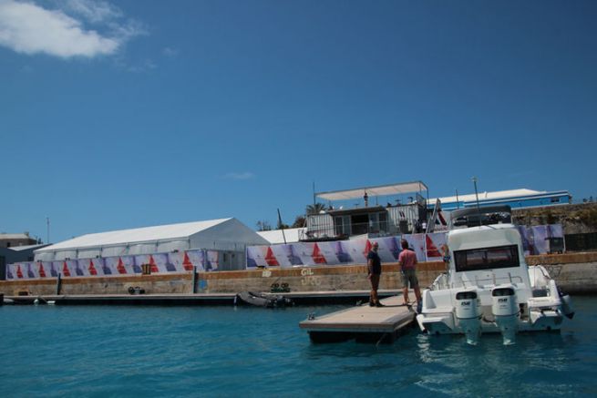 The Groupama Team France base in Bermuda with the accompanying boats at the foot of the dock