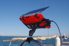 A shelf in its protection with the sun visor at the helm of a sailboat