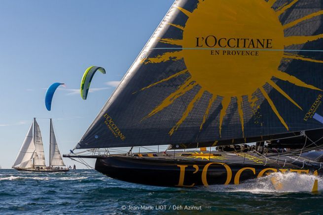 L'Occitane en Provence in full run, Pen Duick III and kitesurfing with foils at its side