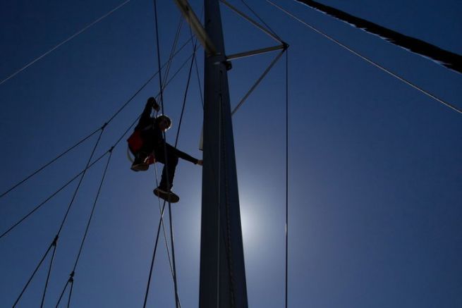 Going up to the mast of the sailboats, why?