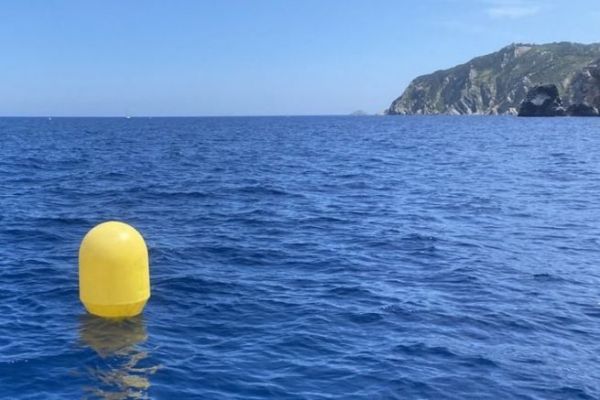 When approaching a coastline, what does this yellow spherical buoy represent?
