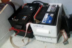 Managing electricity on board: engine and service batteries